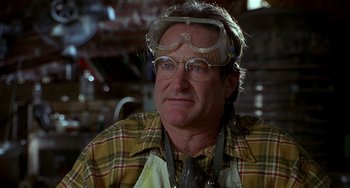 Movie still from “Flubber” (1997), directed by Les Mayfield – A person wearing goggles and an apron; Close Up shot, Low angle