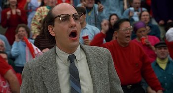 Movie still from “Flubber” (1997), directed by Les Mayfield – A man in a suit and tie with a surprised look on his face; Close Up shot, Low angle