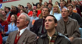 Movie still from “Flubber” (1997), directed by Les Mayfield – A group of people in a crowd watching a game; Close Up shot, Low angle