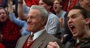 Movie still from “Flubber” (1997), directed by Les Mayfield – An older man in a crowd of people; Close Up shot, Low angle