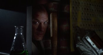 Movie still from “Flubber” (1997), directed by Les Mayfield – A person holding a baseball bat; Close Up shot, Low angle