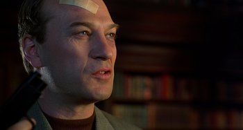 Movie still from “Flubber” (1997), directed by Les Mayfield – A man with a bandage on his head; Close Up shot, Low angle