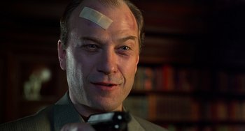 Movie still from “Flubber” (1997), directed by Les Mayfield – A man with bandage on his head and forehead; Close Up shot, Low angle
