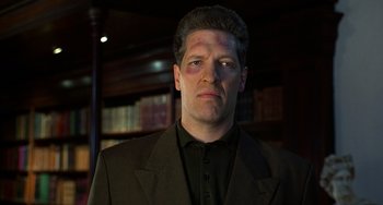 Movie still from “Flubber” (1997), directed by Les Mayfield – A person wearing a suit and tie; Close Up shot, Low angle