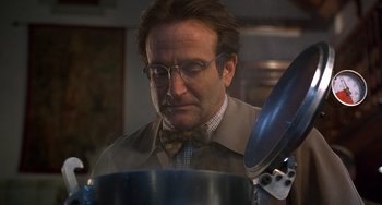 Movie still from “Flubber” (1997), directed by Les Mayfield – A person wearing glasses and a bow tie; Close Up shot, Low angle