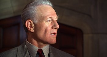Movie still from “Flubber” (1997), directed by Les Mayfield – An older man wearing a suit and a tie; Close Up shot, Low angle