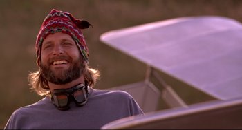 Movie still from “Fly Away Home” (1996), directed by Carroll Ballard – A man with a beard wearing a hat and sunglasses; Close Up shot, Low angle