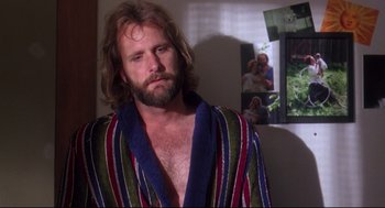 Movie still from “Fly Away Home” (1996), directed by Carroll Ballard – A man with a beard wearing a bathrobe; Close Up shot, Over the shoulder angle