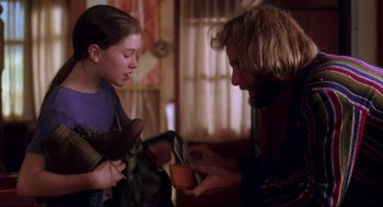Movie still from “Fly Away Home” (1996), directed by Carroll Ballard – A man and a girl looking at a cup; Medium shot, Over the shoulder angle