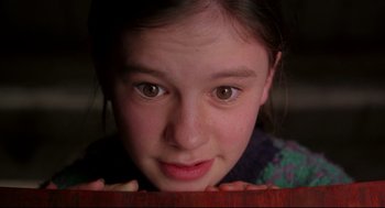 Movie still from “Fly Away Home” (1996), directed by Carroll Ballard – A young girl is looking at the camera; Close Up shot, Low angle