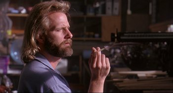Movie still from “Fly Away Home” (1996), directed by Carroll Ballard – A man with a beard is holding something in his hand; Close Up shot, Low angle