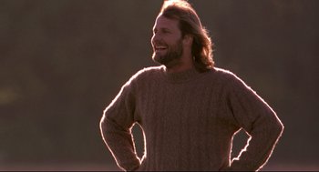 Movie still from “Fly Away Home” (1996), directed by Carroll Ballard – A man with long hair and a beard wearing a sweater; Medium shot, Low angle