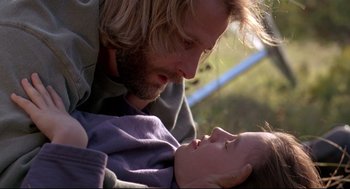 Movie still from “Fly Away Home” (1996), directed by Carroll Ballard – A man and a child laying on the ground; Close Up shot, Low angle