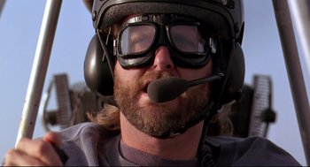 Movie still from “Fly Away Home” (1996), directed by Carroll Ballard – A person wearing a motorcycle helmet; Close Up shot, Low angle