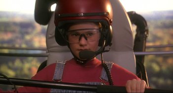 Movie still from “Fly Away Home” (1996), directed by Carroll Ballard – A person with a helmet and a headset on; Close Up shot, Low angle