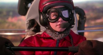 Movie still from “Fly Away Home” (1996), directed by Carroll Ballard – A young boy wearing a red jacket and a helmet; Close Up shot, Low angle