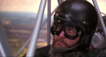 Movie still from “Fly Away Home” (1996), directed by Carroll Ballard – A person wearing goggles and a helmet; Close Up shot, Low angle
