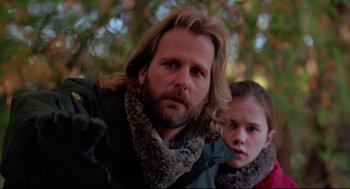 Movie still from “Fly Away Home” (1996), directed by Carroll Ballard – A man and a young girl are posing for a picture; Close Up shot, Low angle