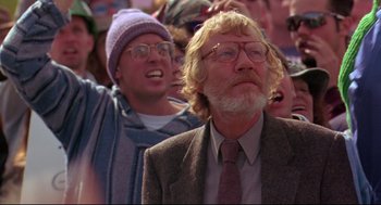 Movie still from “Fly Away Home” (1996), directed by Carroll Ballard – An older man with a beard and glasses is looking up; Close Up shot, Low angle