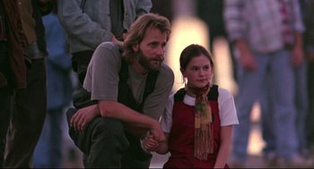 Movie still from “Fly Away Home” (1996), directed by Carroll Ballard – A man and a woman sitting next to each other; Medium shot, Low angle