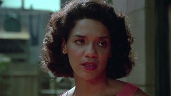 Movie still from “Follow That Bird” (1985), directed by Ken Kwapis – A woman that is looking into the camera; Close Up shot, Low angle