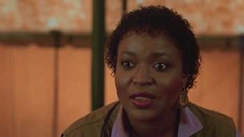 Movie still from “Follow That Bird” (1985), directed by Ken Kwapis – A person wearing a brown jacket; Close Up shot, High angle