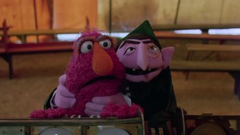 Movie still from “Follow That Bird” (1985), directed by Ken Kwapis – A couple of stuffed animals sitting next to each other; Medium shot, Low angle