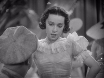 Movie still from “Footlight Parade” (1933), directed by Lloyd Bacon – A black - and - white photo of a woman in a dress; Close Up shot, High angle