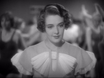 Movie still from “Footlight Parade” (1933), directed by Lloyd Bacon – An old black and white photo of a woman; Close Up shot, Low angle