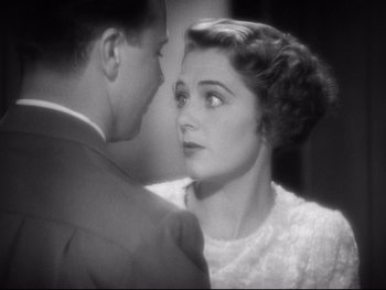 Movie still from “Footlight Parade” (1933), directed by Lloyd Bacon – A man and a woman looking at one another; Close Up shot, High angle