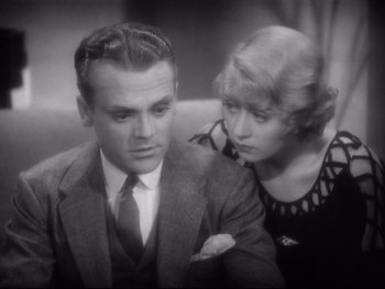 Movie still from “Footlight Parade” (1933), directed by Lloyd Bacon – An old photo of a man and a woman looking at each other; Close Up shot, High angle