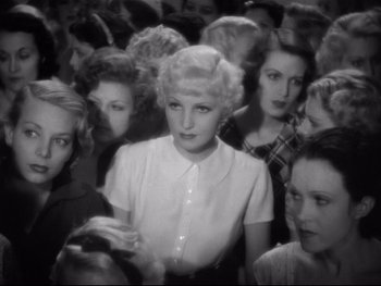 Movie still from “Footlight Parade” (1933), directed by Lloyd Bacon – A group of women standing next to each other in a room; Medium shot, High angle