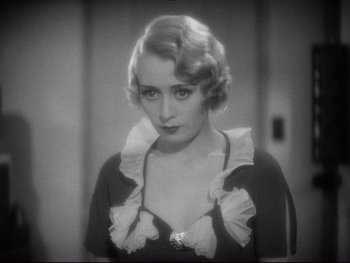 Movie still from “Footlight Parade” (1933), directed by Lloyd Bacon – An old black and white photo of a woman in a dress; Close Up shot, High angle