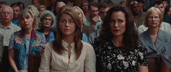 Movie still from “Footloose” (2011), directed by Craig Brewer – Two women and a man in a crowd of people; Close Up shot, Over the shoulder angle