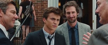 Movie still from “Footloose” (2011), directed by Craig Brewer – Two men standing next to each other in front of a brick building; Close Up shot, Over the shoulder angle