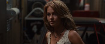 Movie still from “Footloose” (2011), directed by Craig Brewer – A beautiful woman with long blonde hair wearing a white dress; Close Up shot, Over the shoulder angle