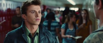 Movie still from “Footloose” (2011), directed by Craig Brewer – A man in a green shirt and a black jacket; Close Up shot, Over the shoulder angle