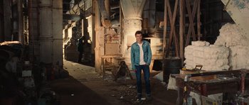 Movie still from “Footloose” (2011), directed by Craig Brewer – A young man standing in an abandoned building; Wide shot, High angle