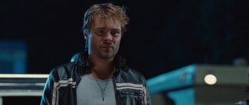 Movie still from “Footloose” (2011), directed by Craig Brewer – A person wearing a leather jacket; Close Up shot, Over the shoulder angle