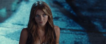 Movie still from “Footloose” (2011), directed by Craig Brewer – A woman with long brown hair and blue eyes looking at the camera; Close Up shot, Over the shoulder angle