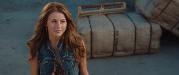 Movie still from “Footloose” (2011), directed by Craig Brewer – A beautiful young woman standing next to a couch; Close Up shot, Over the shoulder angle