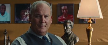 Movie still from “Footloose” (2011), directed by Craig Brewer – A man standing next to a bust of abraham lincoln; Close Up shot, Over the shoulder angle