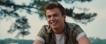 Movie still from “Footloose” (2011), directed by Craig Brewer – A person smiling for the camera; Close Up shot, Over the shoulder angle