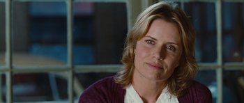 Movie still from “Footloose” (2011), directed by Craig Brewer – A person wearing a shirt and sweater; Close Up shot, Over the shoulder angle