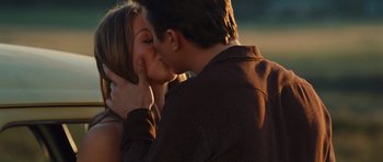 Movie still from “Footloose” (2011), directed by Craig Brewer – A man and a woman kissing on the side of a river; Close Up shot, Over the shoulder angle