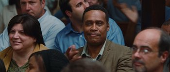 Movie still from “Footloose” (2011), directed by Craig Brewer – A person sitting in a crowd of people; Close Up shot, High angle