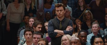 Movie still from “Footloose” (2011), directed by Craig Brewer – A man standing in a crowd of people; Medium shot, High angle