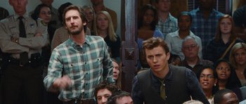 Movie still from “Footloose” (2011), directed by Craig Brewer – A group of people sitting in a room; Medium shot, Over the shoulder angle