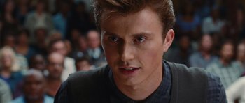 Movie still from “Footloose” (2011), directed by Craig Brewer – A person with a crowd in the background; Close Up shot, Over the shoulder angle