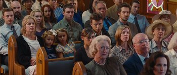 Movie still from “Footloose” (2011), directed by Craig Brewer – A group of people sitting in a room; Medium shot, Over the shoulder angle